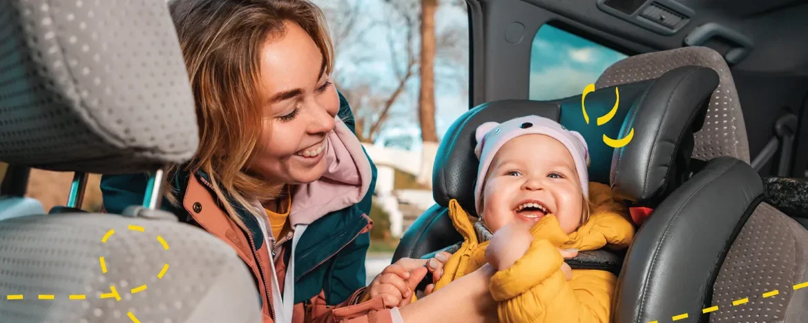 mum putting baby in car