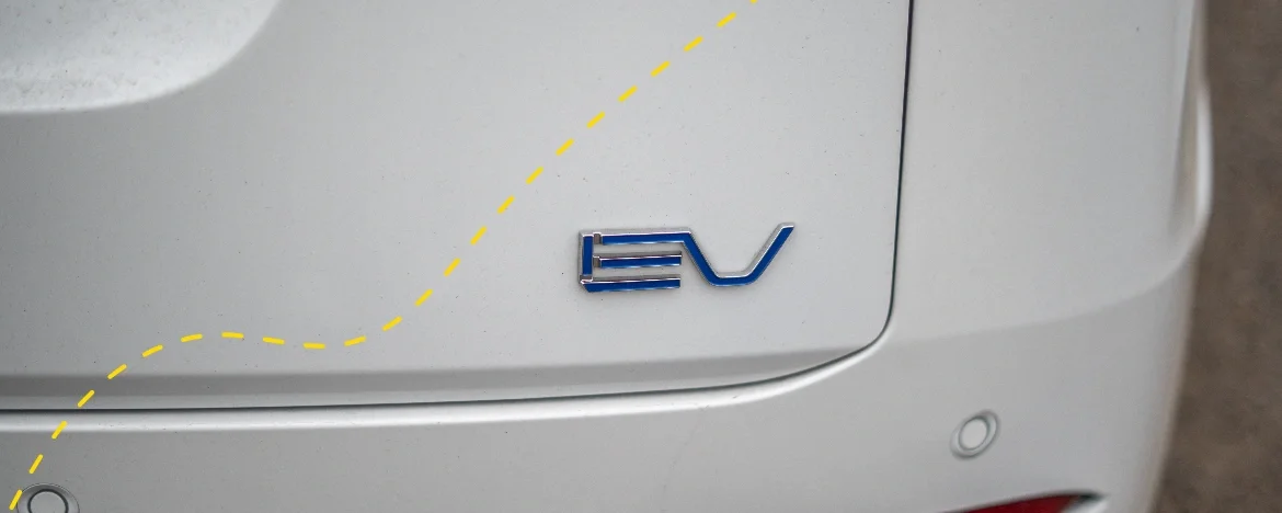 Up close detail of an EV badge