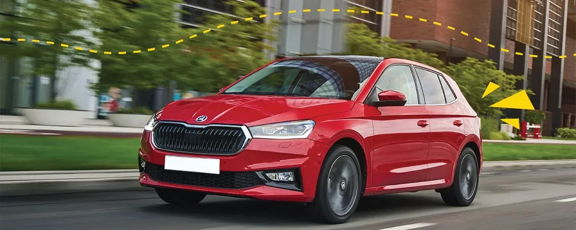 SKODA Fabia driving down residential road