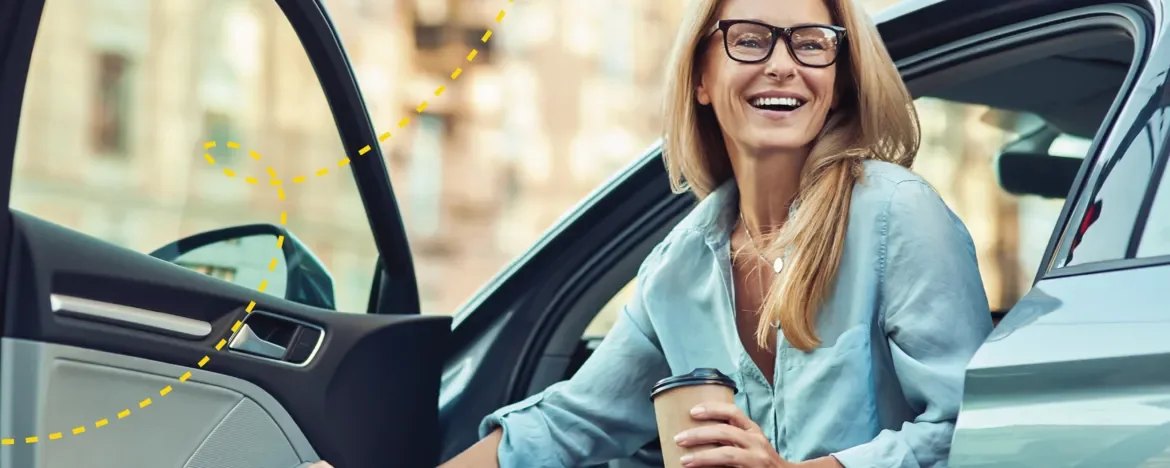 Woman getting out of car