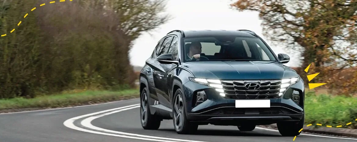 Hyundai Tucson on the road with image accents