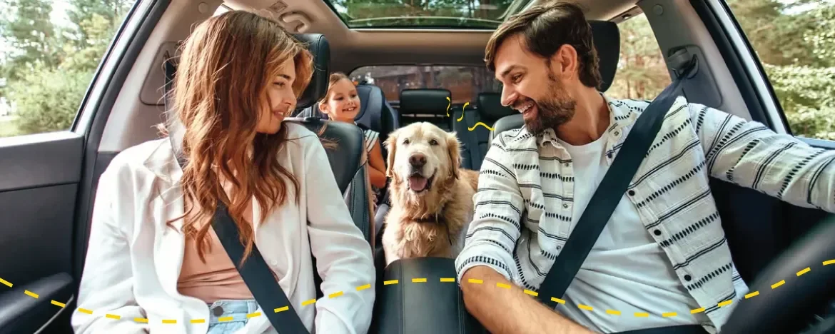 Family with dog in the car
