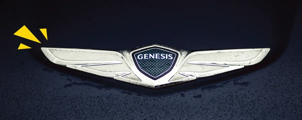 The Genesis logo with yellow accents