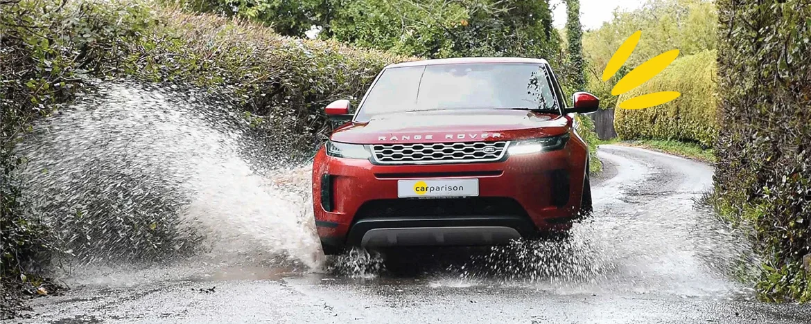 Range Rover Evoque driving through puddle