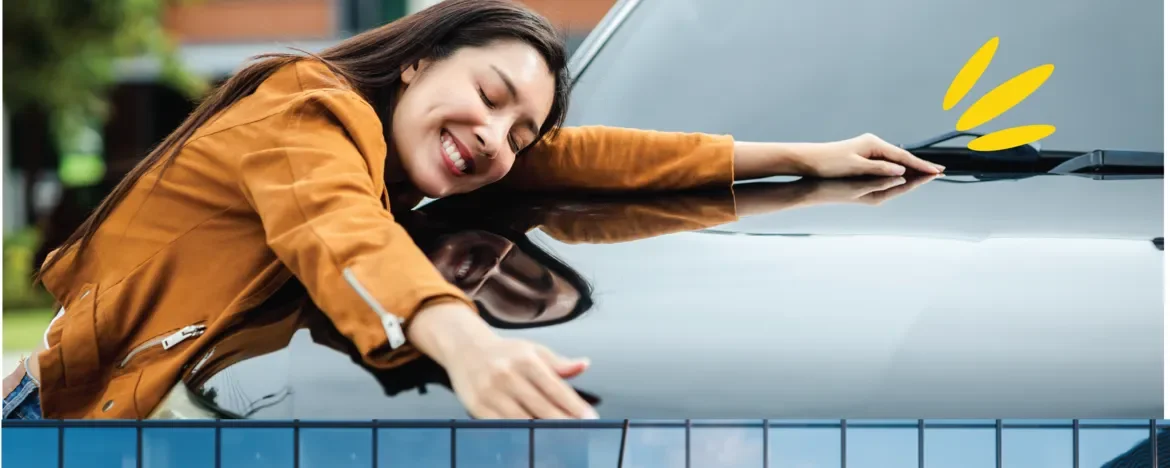 Woman hugging car