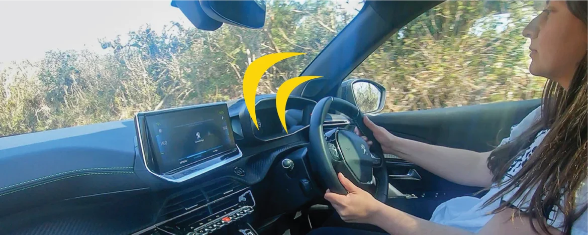 Peugeot E-2008 person driving