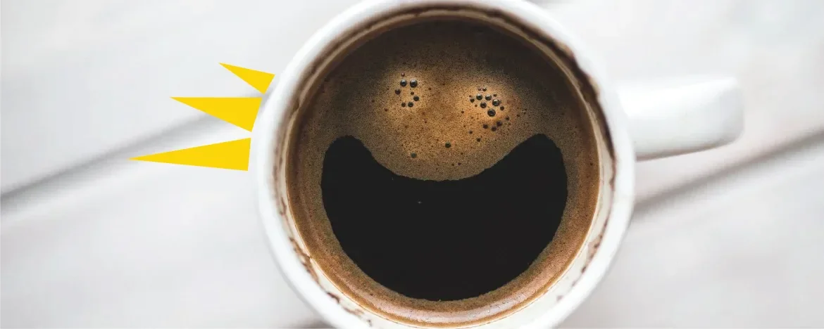 Strong black cup of coffee on a white table