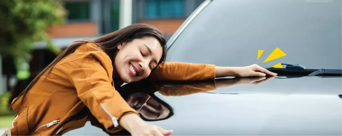 Woman hugging her car