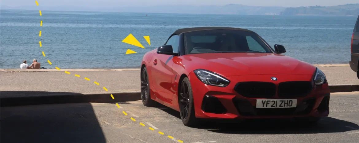 BMW z4 driving by the beach