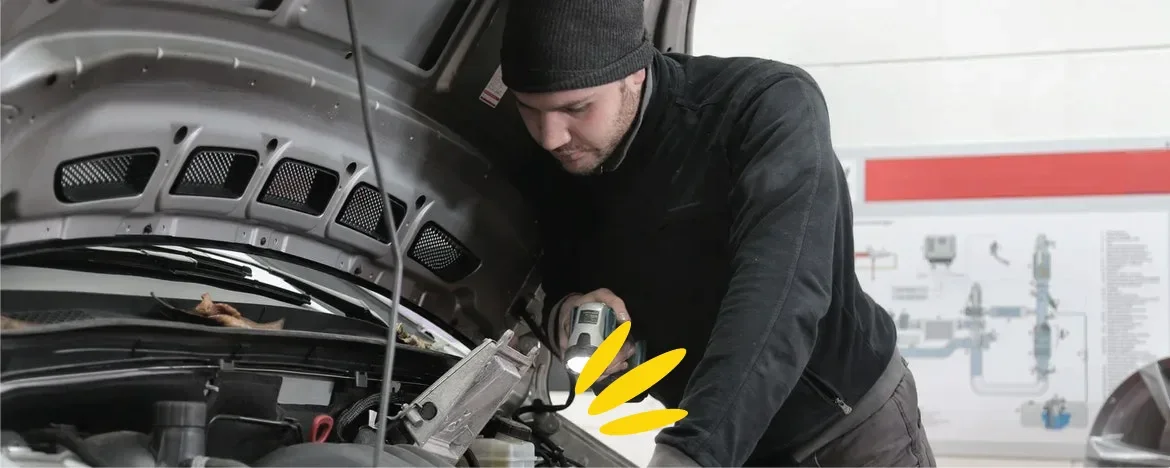 Person looking under the bonnet