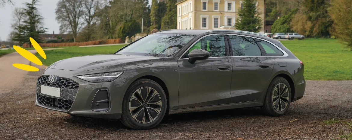 Audi a6 e-hybrid parked in front of Escot