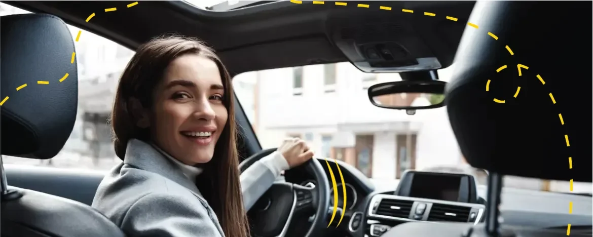 woman looking back in car