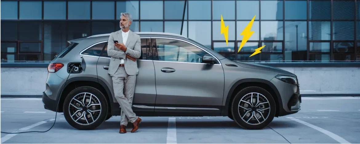 Man stood charging car