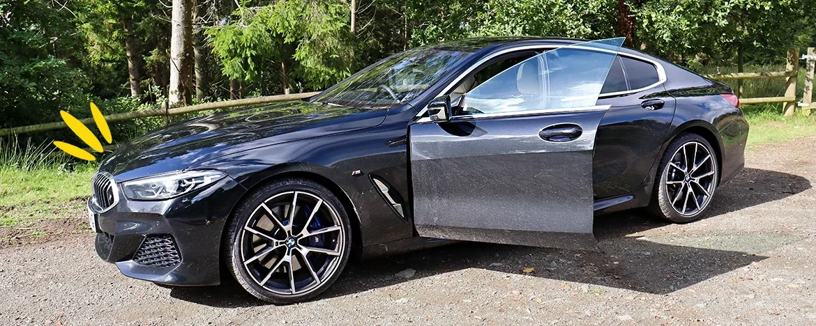 BMW 8 Series 840i Gran Coupe side with door open