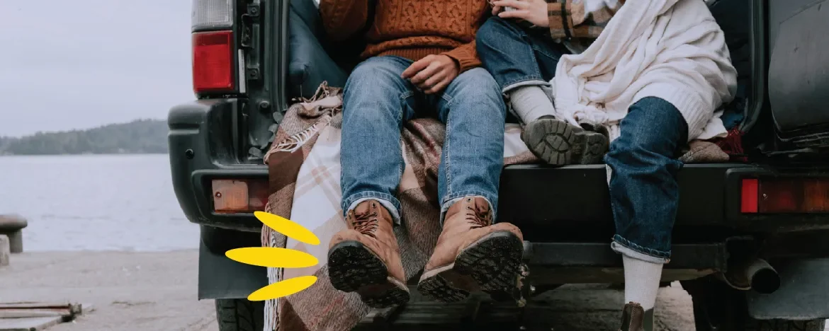 Two people sat in the boot