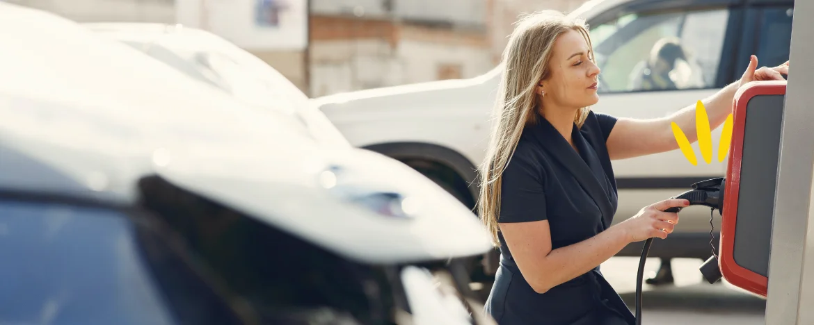 A woman at an electric charging station