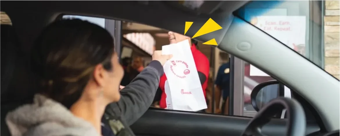 Person buying food at a drive through