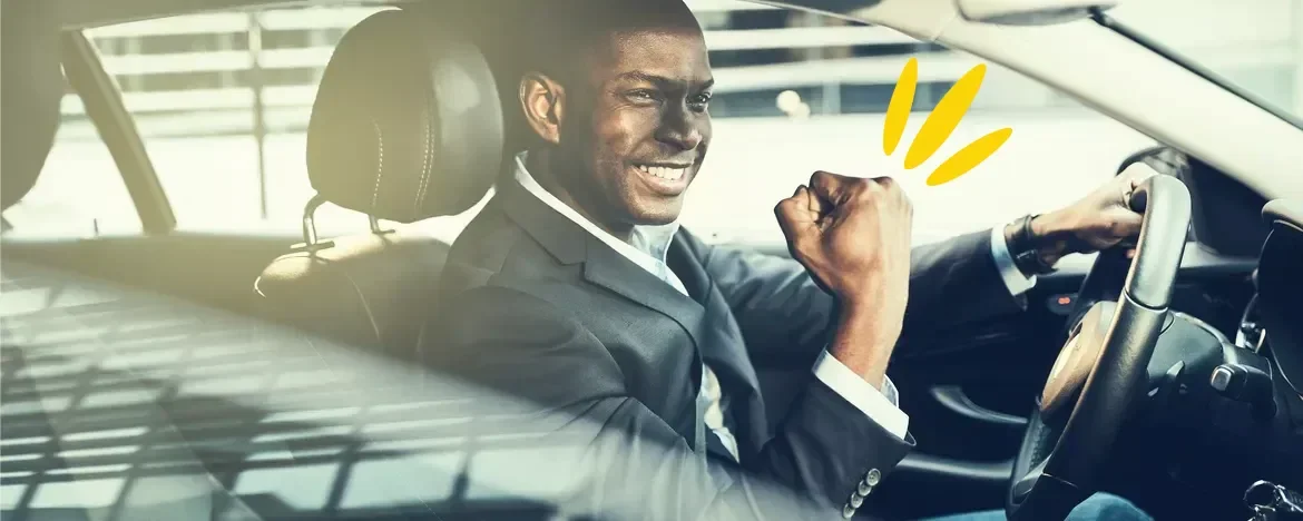 man pumping fist in air