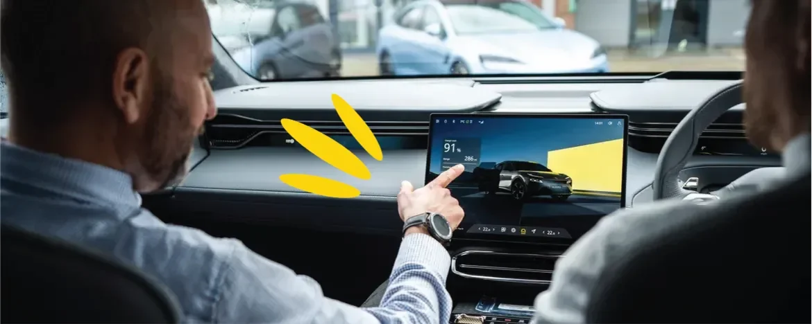 Men pointing at infotainment system