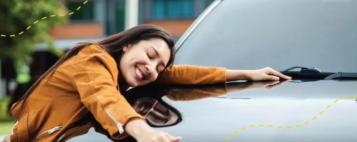 Lady hugging car bonnet
