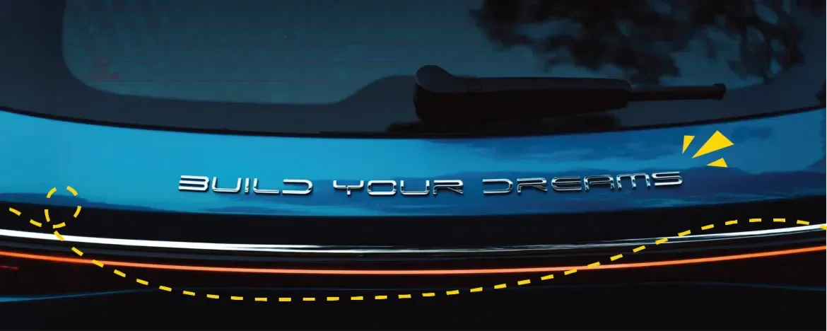 Close up of BYD tagline on car rear with yellow accents