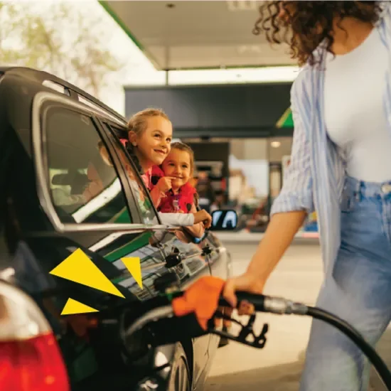 Woman filling up car with fuel