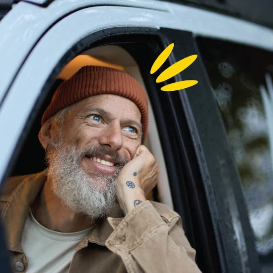 Man daydreaming in van