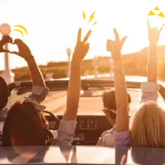 People in car with roof down