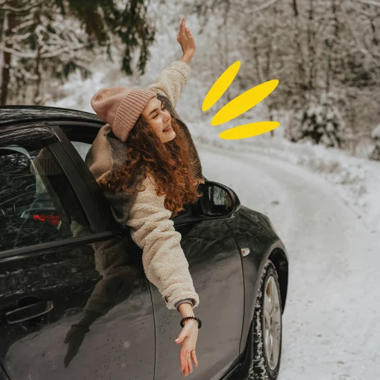 person in car in snow