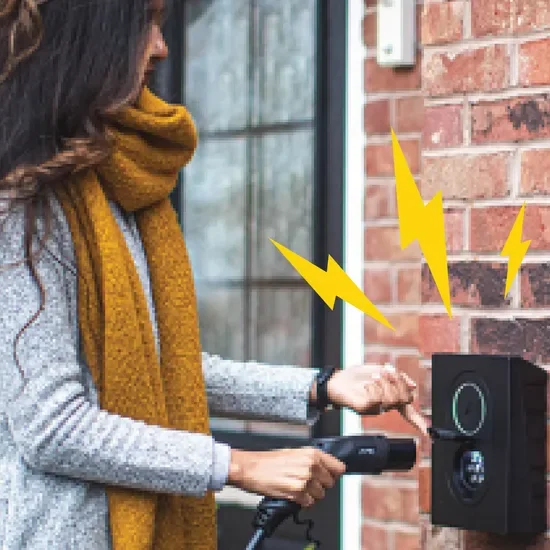 Woman using home wall box EV charger
