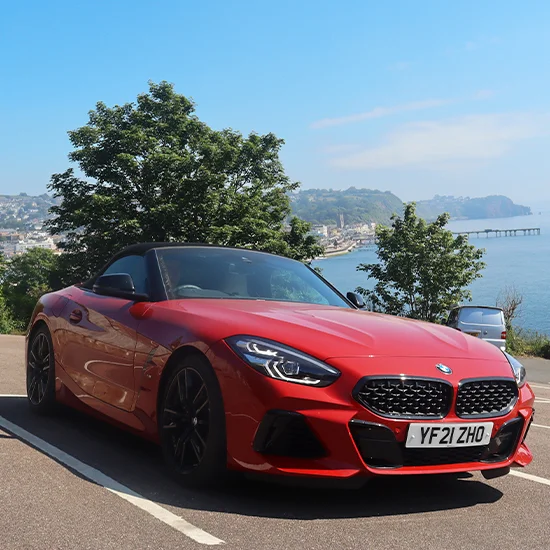 BMW Z4 parked under tree