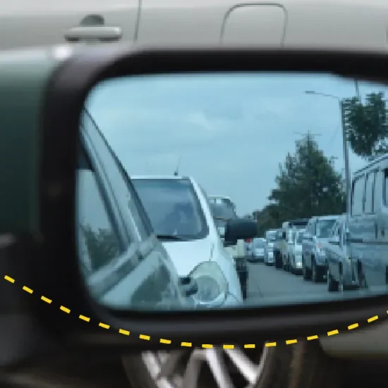 car in wing mirror