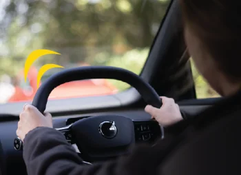Woman driving a Volvo